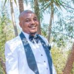 Portrait photograph of missing 45-year-old man Gabriel Toyana wearing a blue hat, showing a scar on his right cheek.